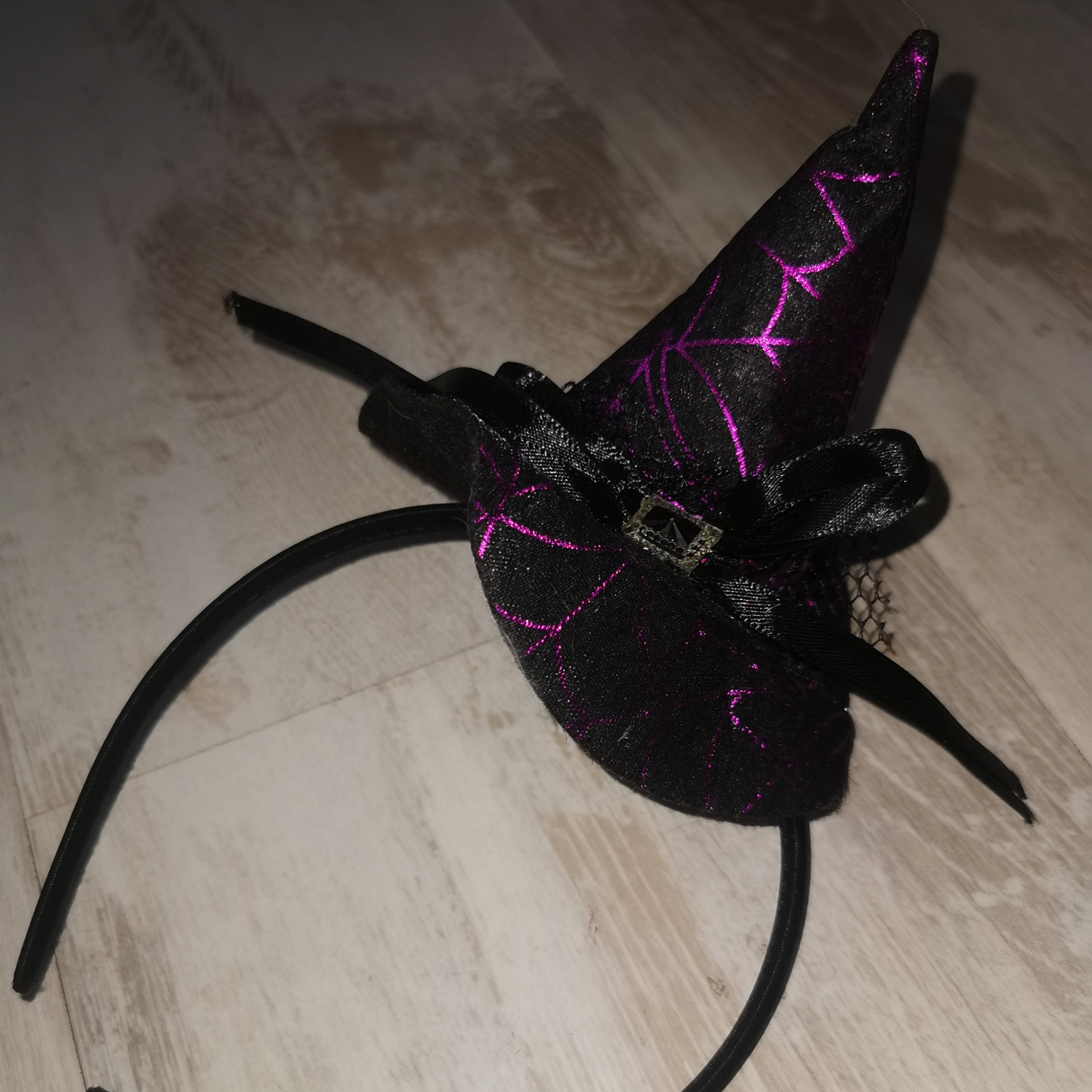 Tiny purple and black witch hat on alice band